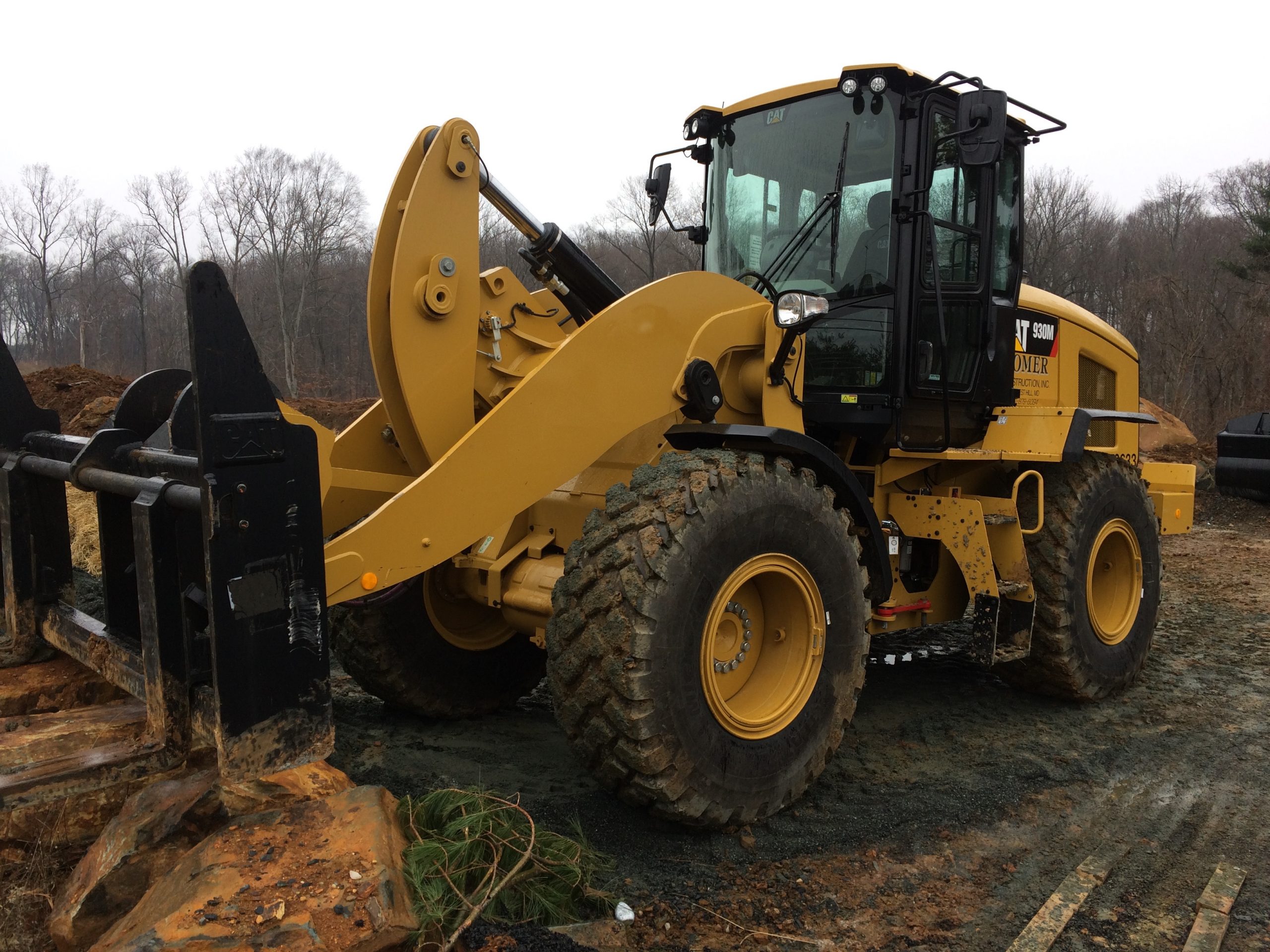 CAT Rubber Tire Loader working in the dirt preparing a site for construction