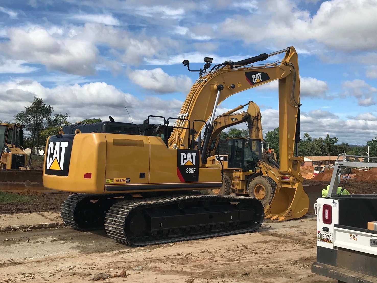 Excavator preparing for digging on a job site 