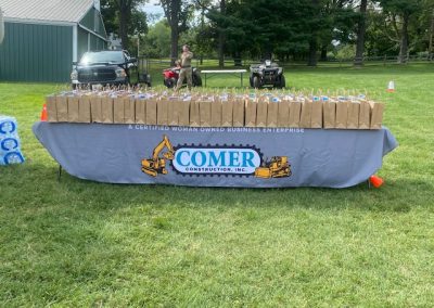 Comer Construction booth with loot bags at the National Night Out in Harford County