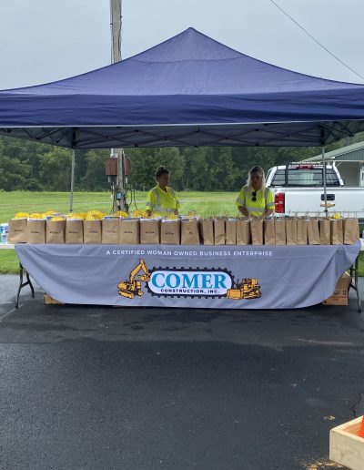 Comer Construction booth with loot bags