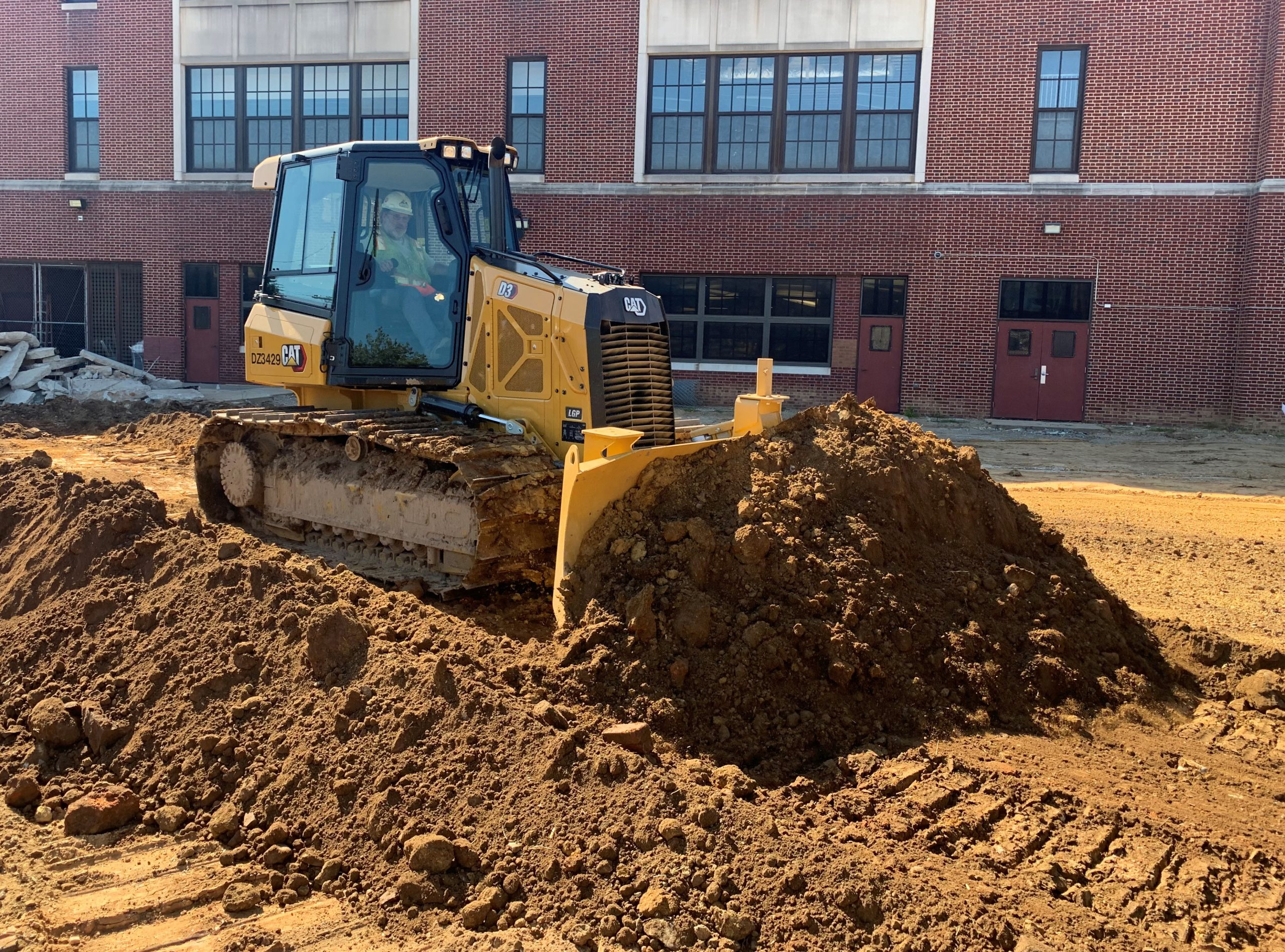 Excavator preparing for digging on a job site 