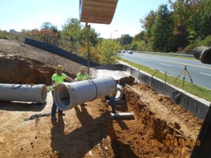 underground utility installation in Baltimore county. Placing sewer lines for a park
