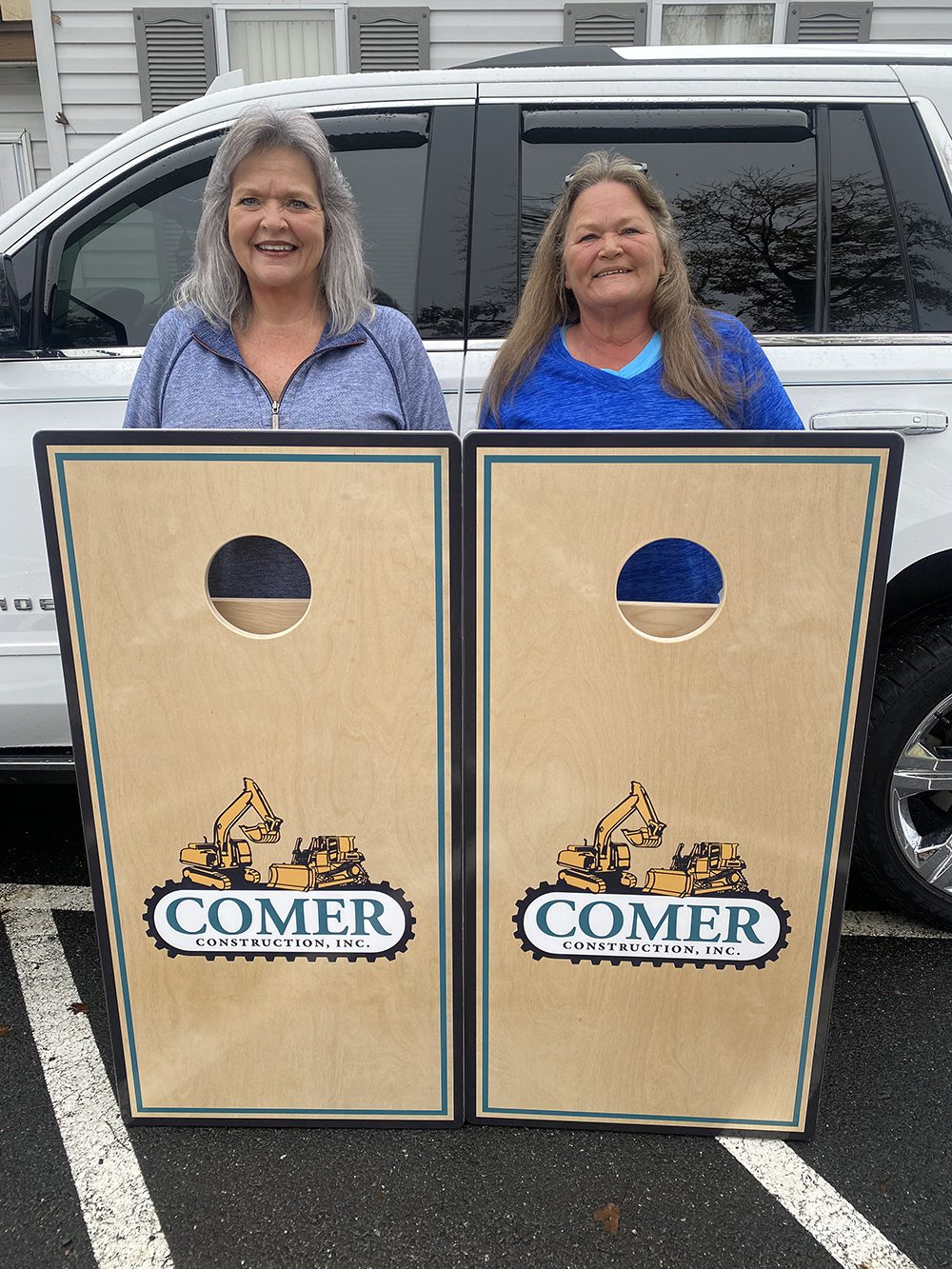 Susie and Leona with Cornhole Boards