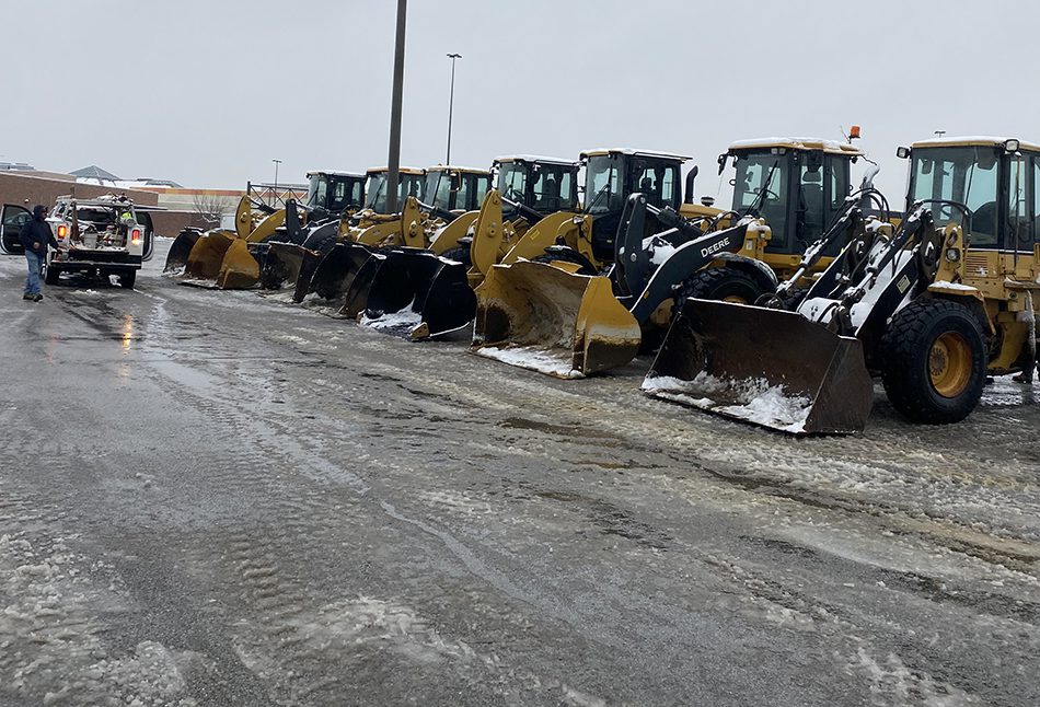 Snow Removal on a Commercial Driveway with a Bulldozer