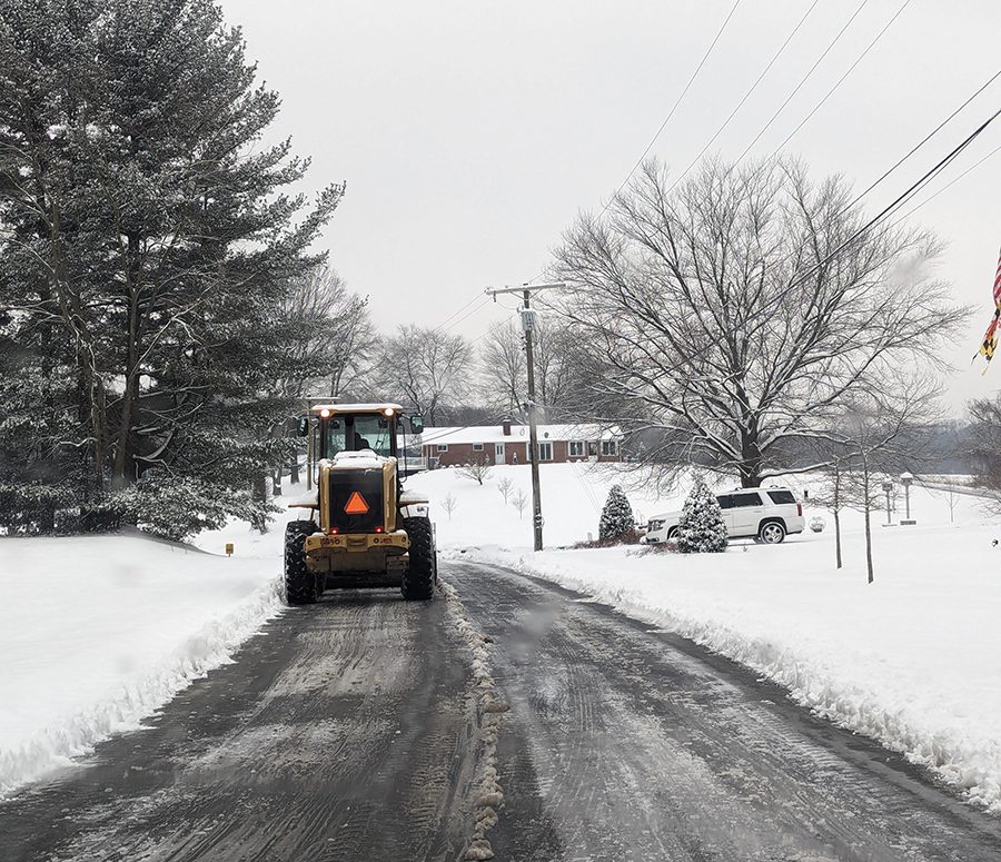 Snow Removal on a Commercial Driveway with a Bulldozer