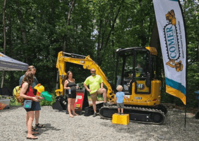 Comer Construction vehicles at a local touch-a-truck event