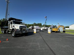 Comer Construction vehicles at a local touch-a-truck event