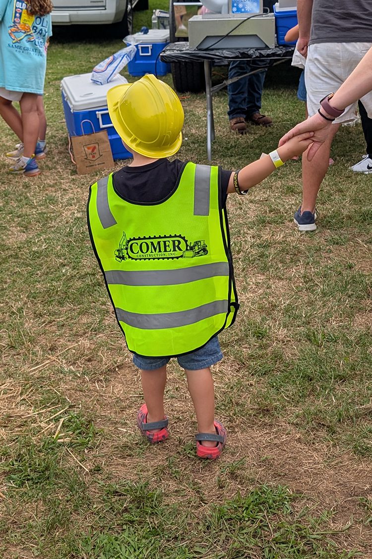 Child wearing Comer vest at National Night Out