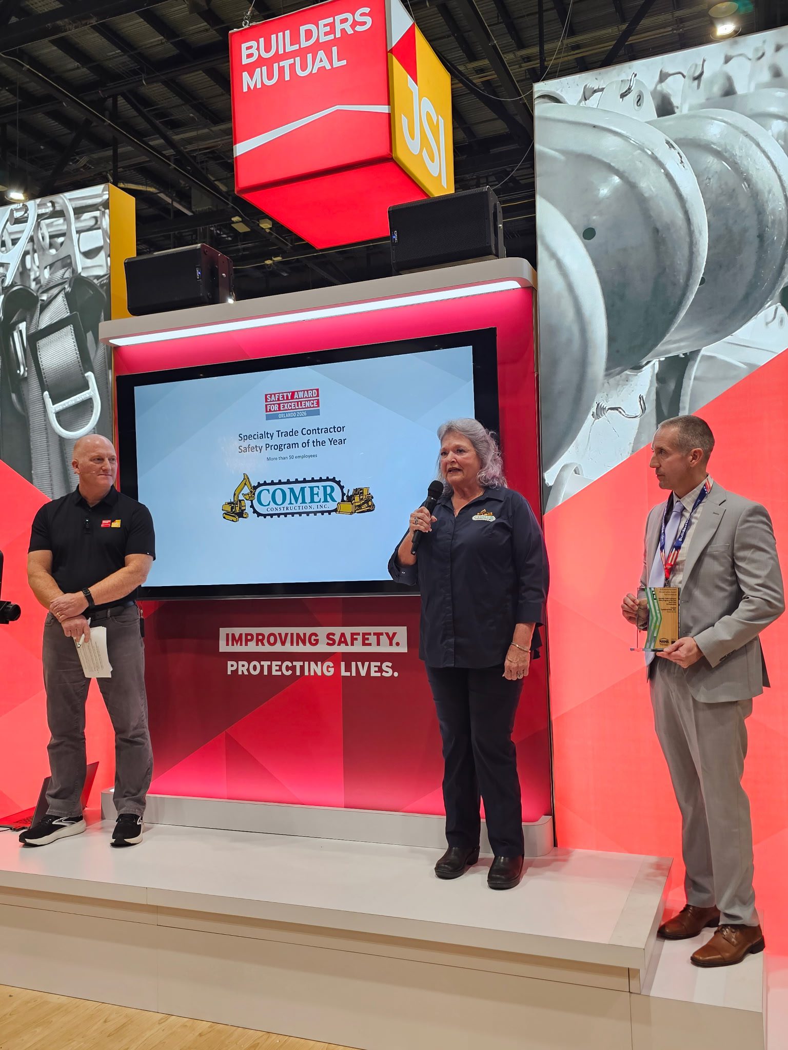 Susie Comer accepting the safety award on stage