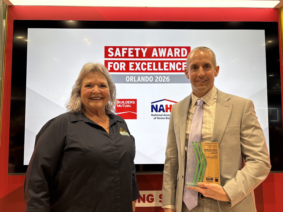 Susie and Tim accepting the award