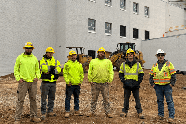 six-person crew photo, new building facade