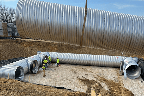 Site construction with large metal pipes in west Baltimore