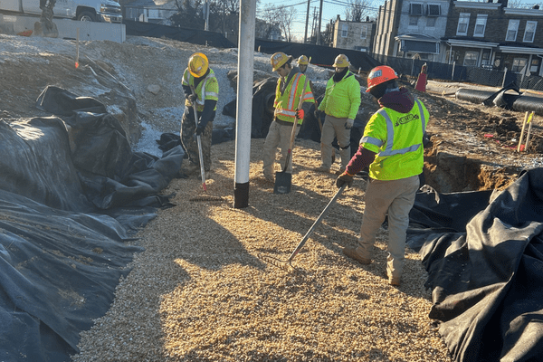 crew spreading gravel aggregate
