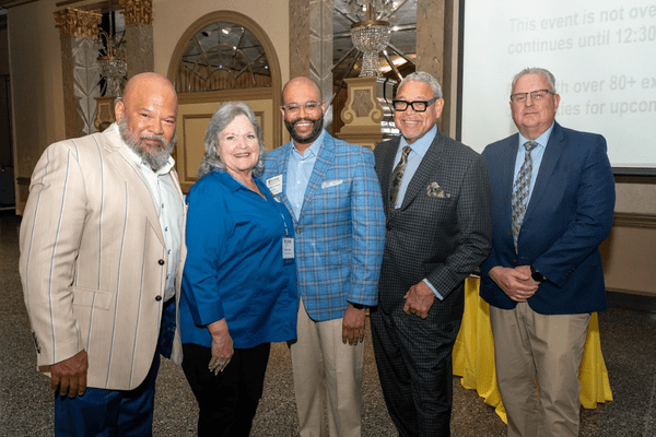 Susie Comer standing with MWMCA leaders
