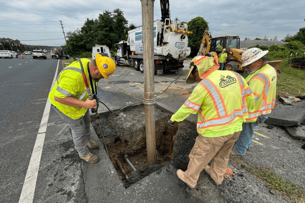 Construction team repairing underground utilities